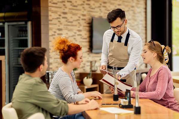 Waiter dealing with customers' complaints