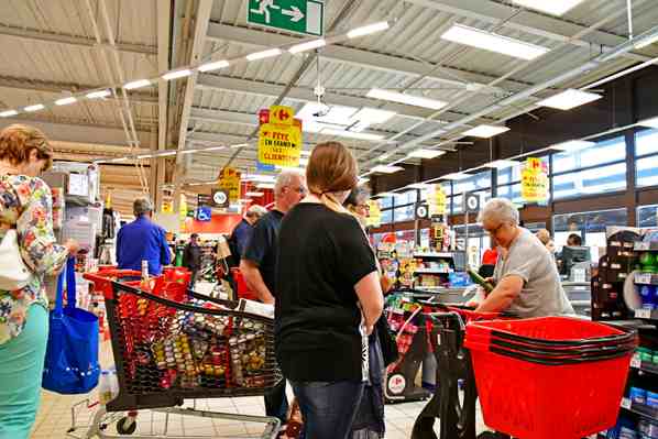 Shoppers waiting in a queue