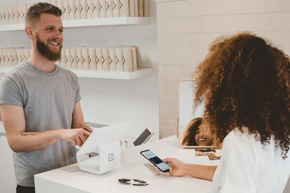 Customer paying with smartphone