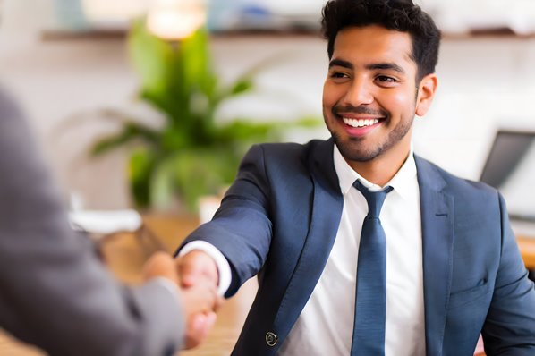 Bank executive shaking hands with client