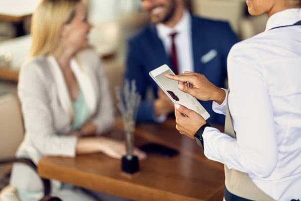 Guests giving feedback to hotel manager