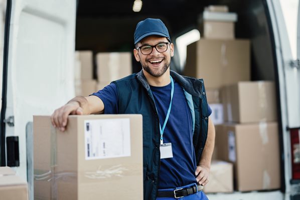 Smiling courier making a delivery